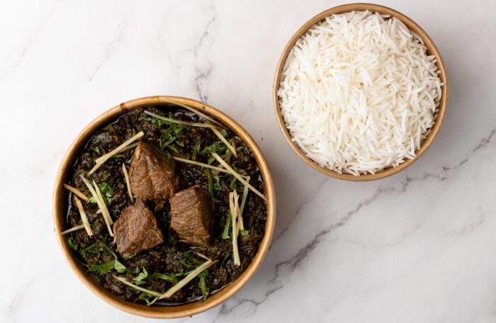 Saag Gosht (spinach and beef) with bowl of rice