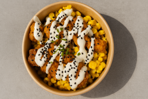 Khokha Eatery's Mac 'n' Chicken Bowl with crispy chicken, creamy mac and cheese, and sauces